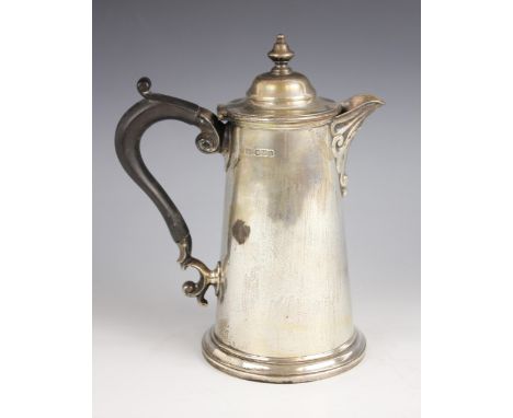 A George V silver hot water jug, Harrison Brothers & Howson, Sheffield 1923, of tapering cylindrical form on raised circular 