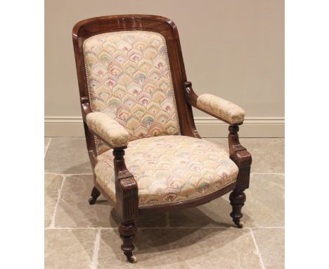 A Victorian walnut and upholstered drawing room chair, the concave padded back extending to straight arms over a bowfront spr