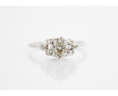 An early 20th century diamond ring, the central old cushion cut diamond measuring approximately 6.1mm x 6.1mm x 3.8mm, claw s