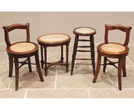 A pair of 19th century elm and rattan stools, each with a shaped compact rail back rest above a circular cane work seat, rais