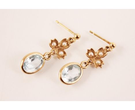 A pair of Edwardian style topaz and cultured pearl drop earrings, each designed as an oval mixed cut blue topaz measuring 8mm