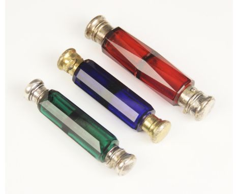 A Victorian double ended cranberry glass scent bottle by Asser & Sherwin, the cylindrical cut glass body with two compartment