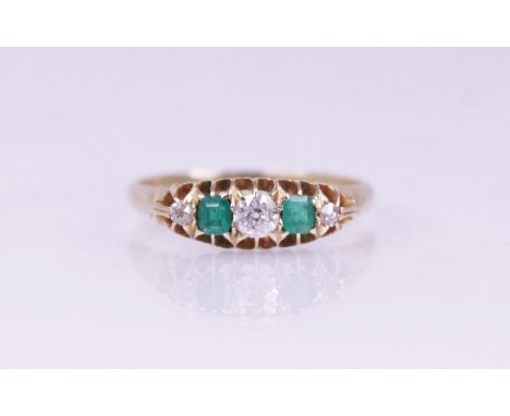 A Victorian emerald and diamond five-stone ring, comprising a central round mixed cut diamond measuring 3.2mm x 2.2mm, with a