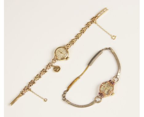 A lady's vintage 9ct gold Rotary Maximus cocktail watch, the circular cream dial with Arabic and baton markers, set to a plai