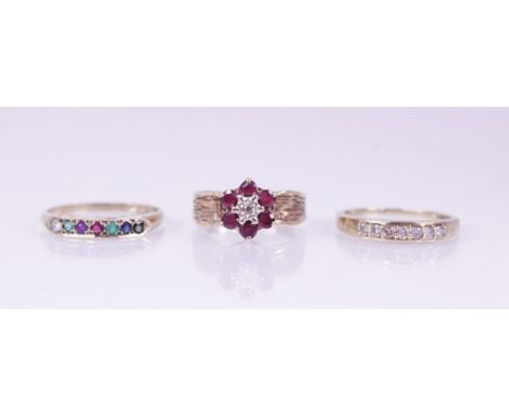 A 9ct gold acrostic ring, comprising seven round mixed cut gemstones spelling 'Dearest' (diamond, emerald, amethyst, ruby, em