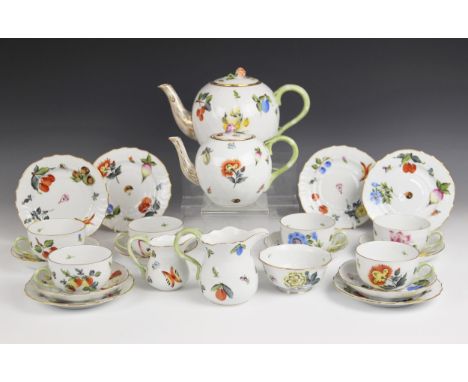 A Herend tea service, comprising; a large teapot and cover, a small teapot and cover, six teacups, six saucers (one at fault)