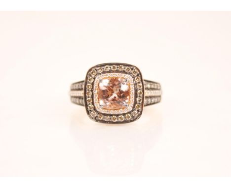 A peach topaz (untested) and diamond 14ct gold ring by Le Vian, the tiered cluster designed as a central cushion cut peach to