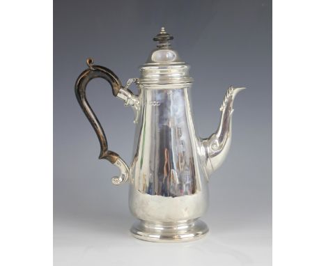 A late Victorian silver coffee pot, London 1899 (maker's marks worn), of tapering cylindrical form on raised circular foot, c