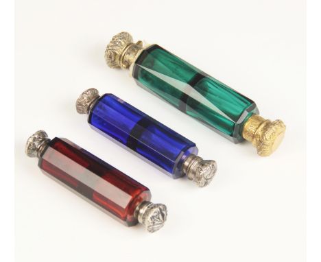 A Victorian green glass double-ended scent bottle, the cylindrical cut glass body with two division interior, screw cap to on