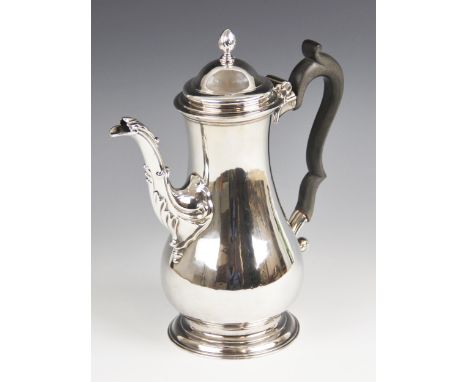 A George III silver coffee pot, London 1764 (maker's marks worn), of baluster form on raised foot, cast spout and scrolling e