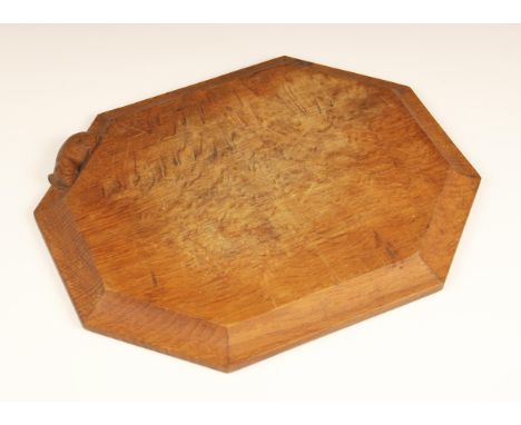 Workshop of Robert 'Mouseman' Thompson, Kilburn, an octagonal breadboard, carved trademark mouse to the moulded edge, 30cm x 