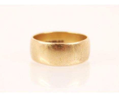 A 9ct gold wedding band, S&amp;W, London 1973, ring size R 1/2, weight 5.7gms 