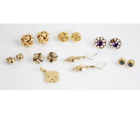 A pair of 9ct gold twist or knot design earrings, 16mm diameter, together with a pair of amethyst set 9ct gold floral earring