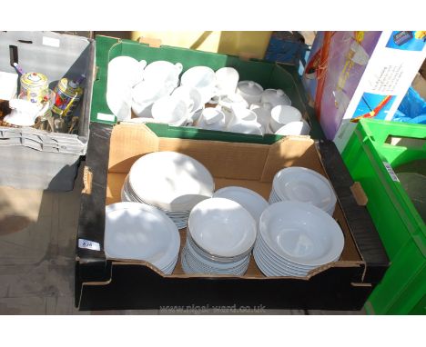 Two boxes of white china to include saucers,plates, bowls, large cups, sucrier, jugs etc. 