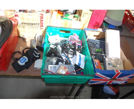 A box of electronics, plugs, walkie talkie, Gym Buddy, telephone, books etc.