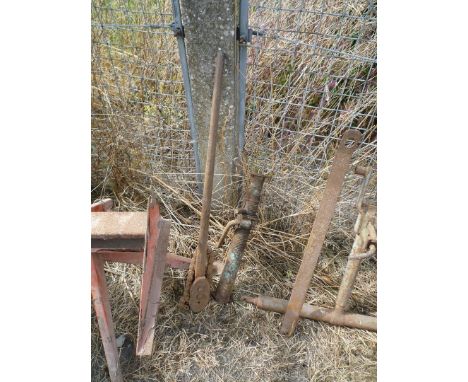 A short Acrow prop and a pipe wrench.