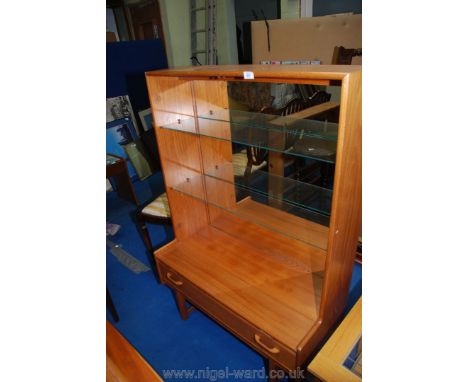 A small modern side board with shelves, mirrored back and light, 4' 41/2" x 3'.