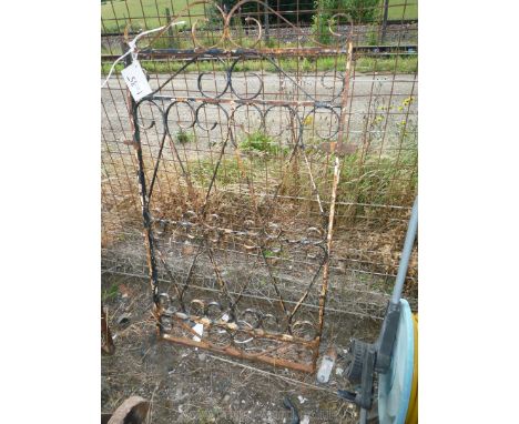 A wrought iron narrow gate, 25" wide by 46" tall.