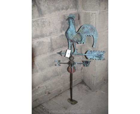 A cockerel weather vane.