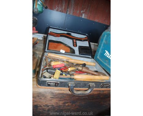 A cased set of tools including; chisels, screwdrivers, etc.