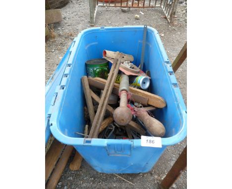 A blue tub of tools, saws, wire brushes etc