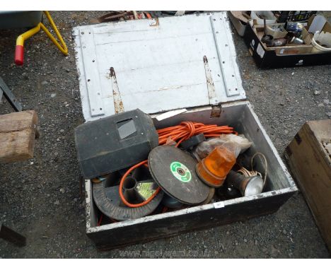 A wooden tool chest and contents: cable, welding mask, rotary beacon, etc.,