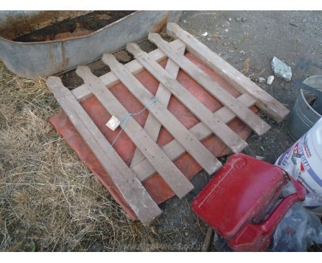 A wooden garden gate, 34" wide, 34" high and a plastic sheet.