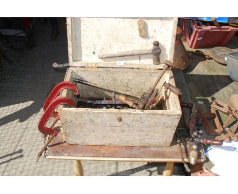 A wooden box of miscellaneous old tools to include clamps, hammer, oil gun etc.