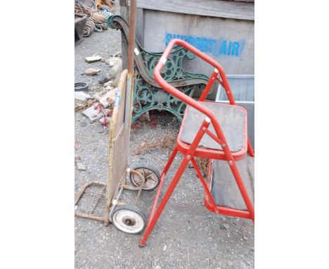 A small trolley and a two step ladder.