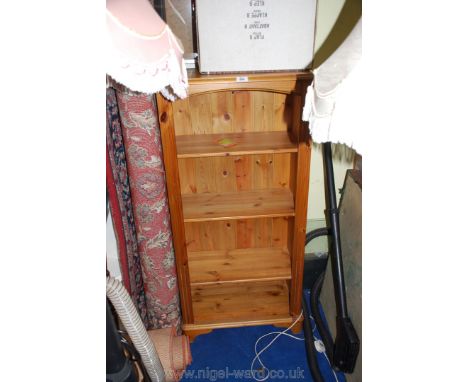 A pine three shelf bookshelves 