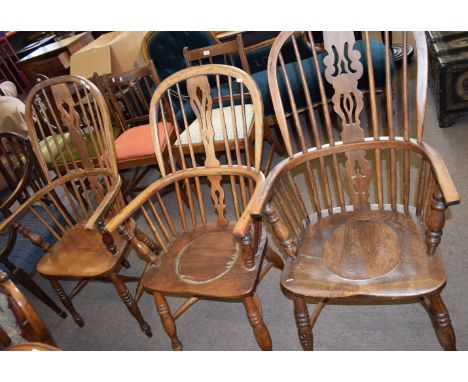 Two oak converted Windsor style commode chairs and a further Windsor style stick back armchair (3) 