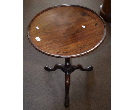 Early 19th century mahogany pedestal table, circular form with ring turned support terminating in tripod base with hoof feet 