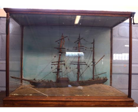 19th century model of a three-masted clipper or sloop in light oak frame, 77cm long