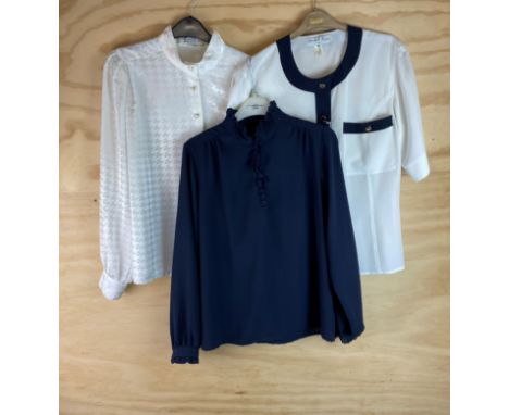 A group of three shirts: A Fink Modell size 12 button down shirt (four buttons A/F), L. 69cm, shoulder W. 37cm, sleeve L. 64c