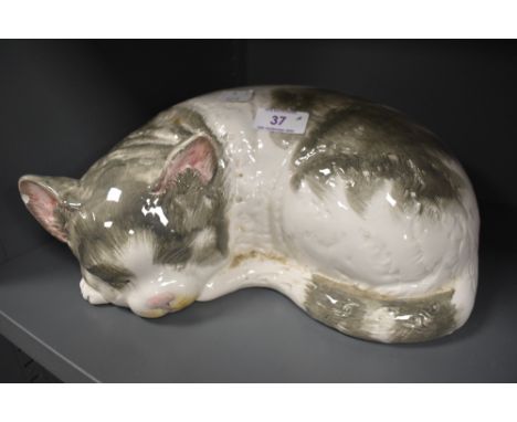 A ceramic figure of a tabby cat possibly by Cappo De Monte signed Italy to base (chips to ears)