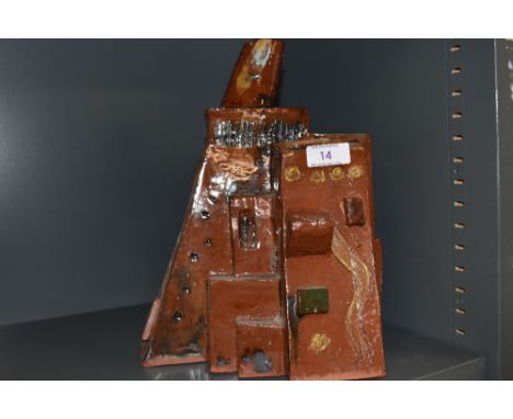 An unusual studio art ceramic in a terracotta pottery in the style of a Eastern abode