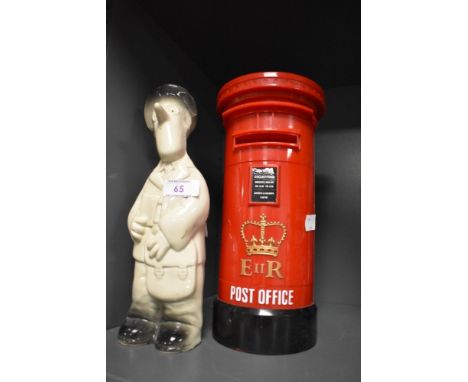 A ceramic Postman Pat figure and accompanying Post box