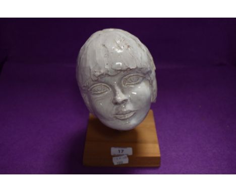 An interesting studio pottery ceramic modelled as a girls head