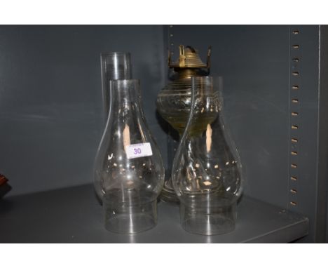 A glass bodied oil lamp and flutes