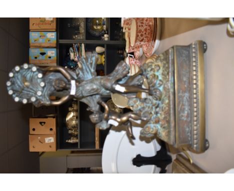 A rococo styled PAOR Spanish bronzed mantle clock having ormolu decoration.