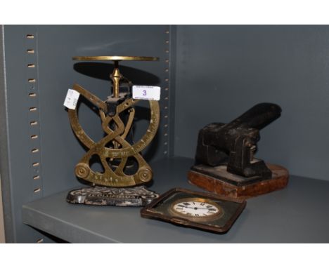 A mechanical set of balance kitchen or chemist scales by Columbus, travel clock and industrial hole punch