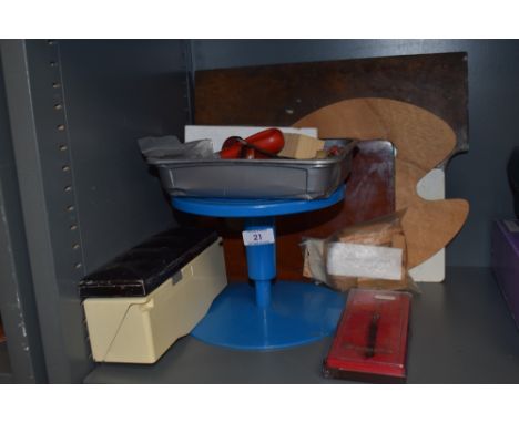 A selection of artist ceramist and potters tools including wheel and palettes