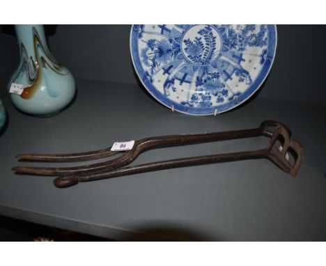 A vintage wrought iron branding iron for letter B and similar large fork