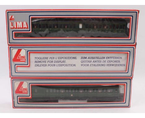 A Lima 00 gauge BR green three car class 117 DMU housed in the original window display and polystyrene packed boxes