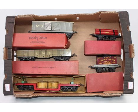 Tray containing 5 Hornby wagons:- 1935-9 trolley wagon, red base, green bolsters, black bogies (E-BVG); 1936-41 LMS high capa