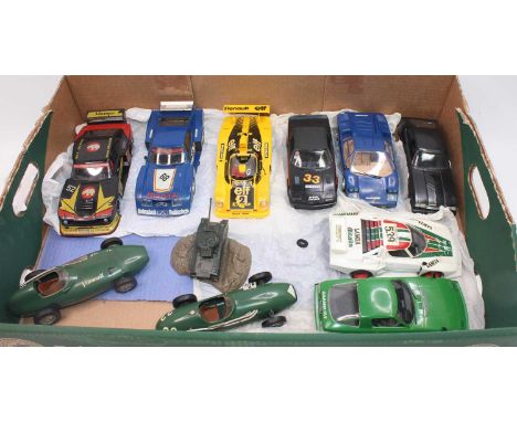 A group of 9 plastic kit type race car models fully finished in 1:24th and 1:25th scales includes a TR7 in black and 2 Merit 