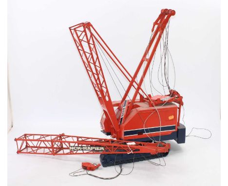 1/16 scale model of NCH Rapier 605-2C Crawler mounted lift crane, one track detached, with a perspex display sign detailing t