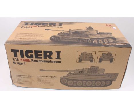 A Taigen 1/16 scale model of a radio controlled 2.4 GHZ Tiger 1 German battle tank, with smoking function and handset, housed