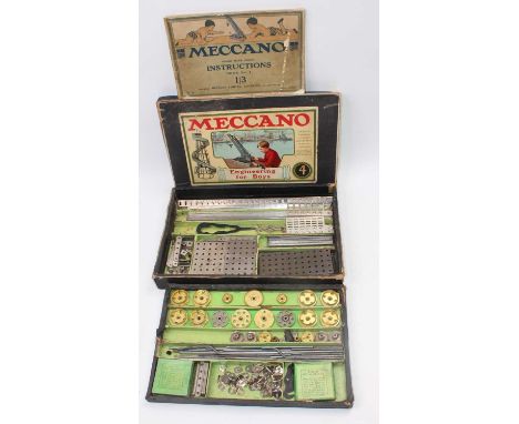 A Meccano 1920s No. 4 outfit, nickel, housed in the original black ground labelled No. 4 box with manual (VG,BF-G)