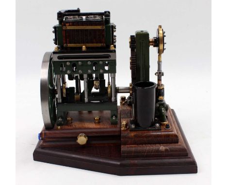 A very well engineered scratchbuilt model of a twin-cylinder water pump stationary engine, comprising of twin wooden-clad cyl